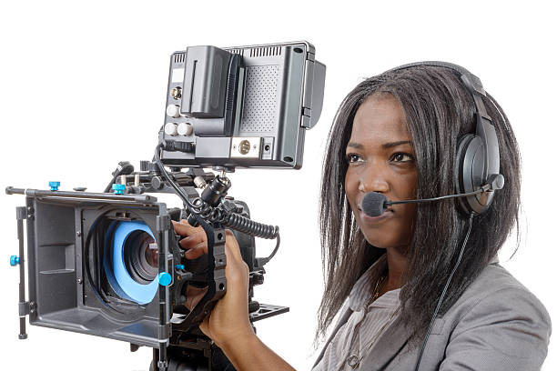 istock young African American women with professional video camera 526277230