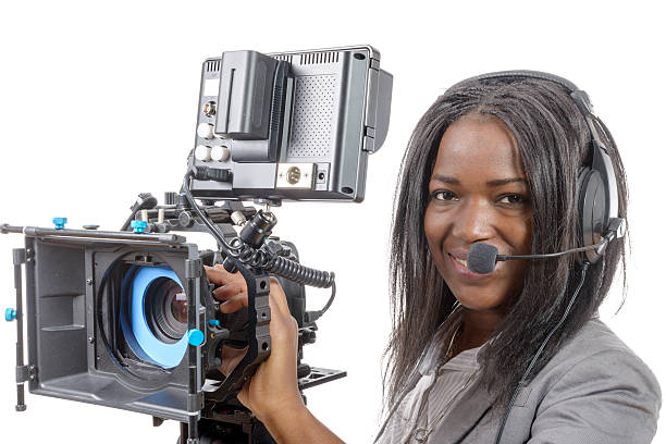 istock young African American women with professional video camera 526277542