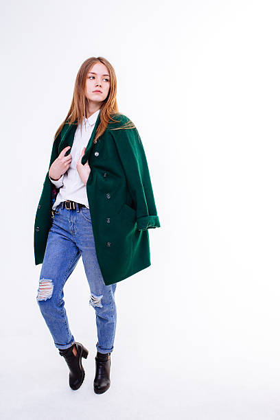 istock Beautiful young girl standing in coat. 526277936