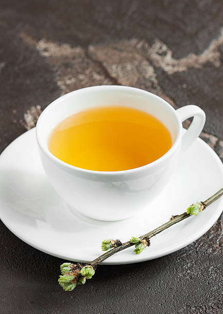 istock Cup of tea useful on a concrete background 526278490