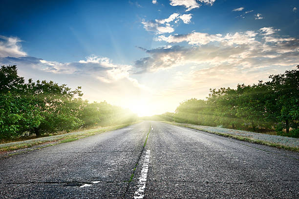 istock highway road at sunset, travel and transportation concept 526281586