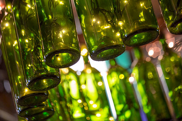 istock Green Wine Bottles as Light Fixture, Abstract Background 526281690
