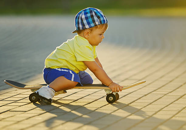 istock cute little boy with skateboard outdoors 526282168