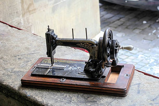 istock Antique sewing machine near the window in the sunlight. 526282180