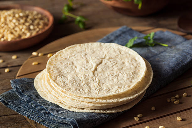 Homemade White Corn Tortillas Homemade White Corn Tortillas in a Stack tortilla flatbread stock pictures, royalty-free photos & images