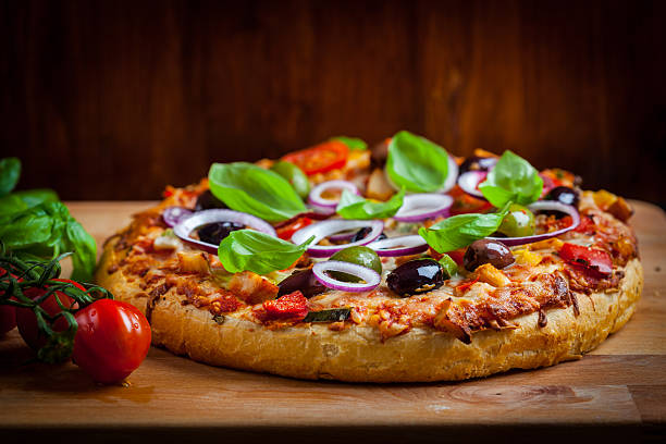 istock Traditional homemade pizza with tomatoes and olives 526283354