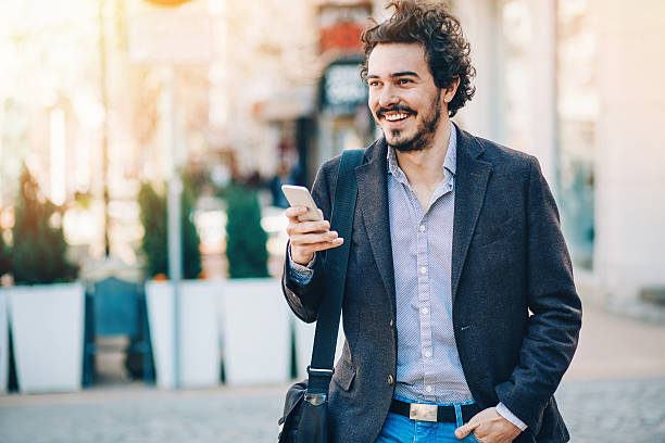 istock Young man with phone on the street 526283862
