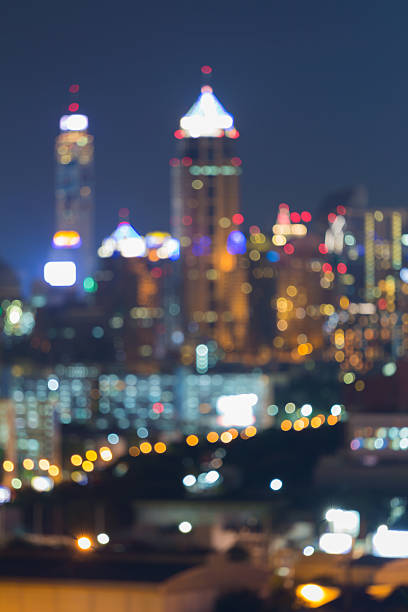 istock Blurred bokeh lights city office building 526284528