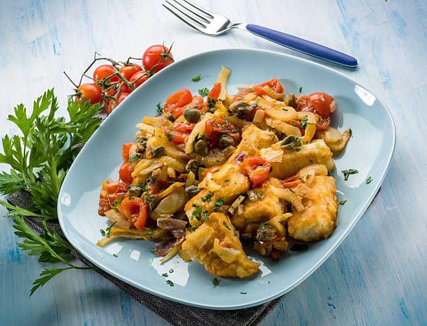 istock fish with fennel tomatoes and capers 526284655