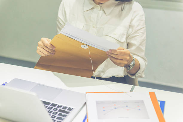 istock Asian office lady checking information on sales reports 526284994