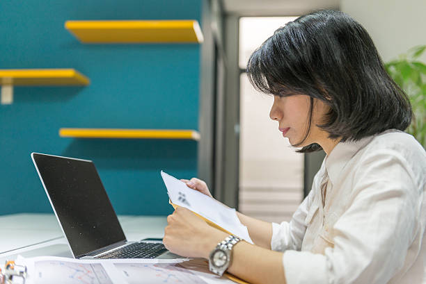 istock Reading sales report and thinking of improve sales volume 526285292