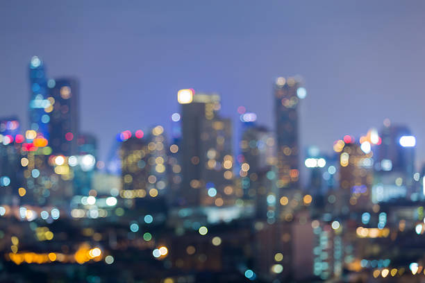 istock Abstract blurred bokeh lights, city office building night view 526285346
