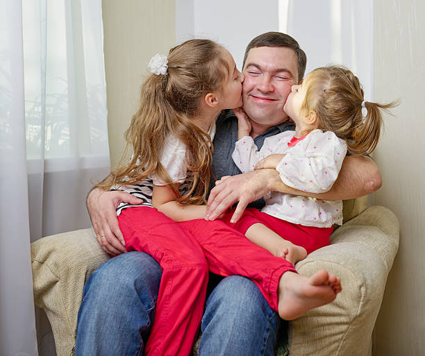 istock father with daughter at home 526285566