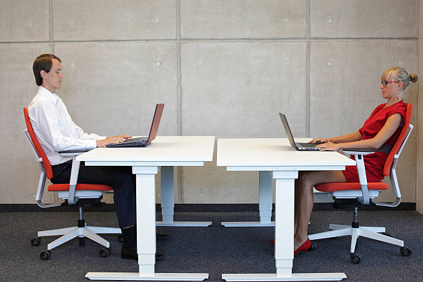 istock business couple in correct sitting posture at workstations 526286073