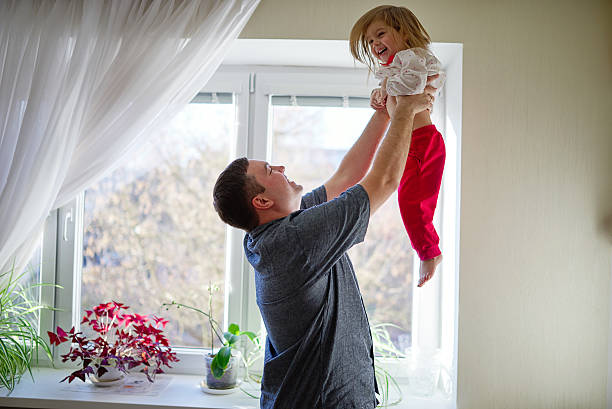 istock father with daughter at home 526286154