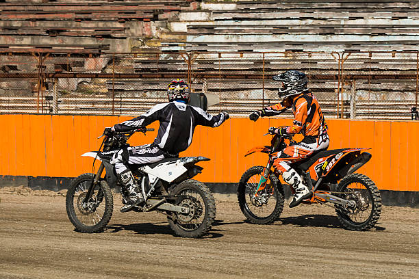 Unknown racers shake hands after the finish stock photo