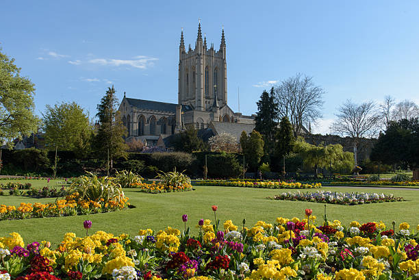 St Edmundsbury Cathedral St Edmundsbury Cathedral with flowers in foreground bury st edmunds stock pictures, royalty-free photos & images