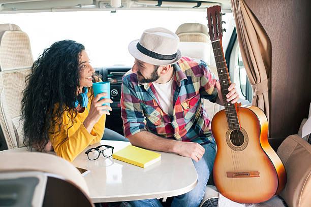istock Young couple having fun inside of camper van 526288922