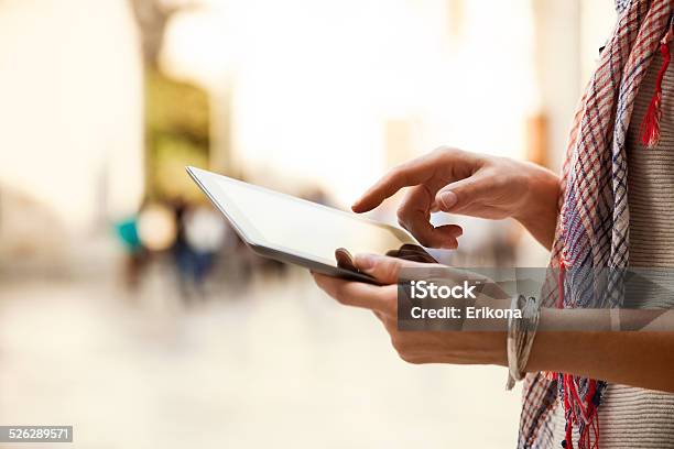 Woman Uses Digital Tablet Stock Photo - Download Image Now - Digital Tablet, Newspaper, Reading