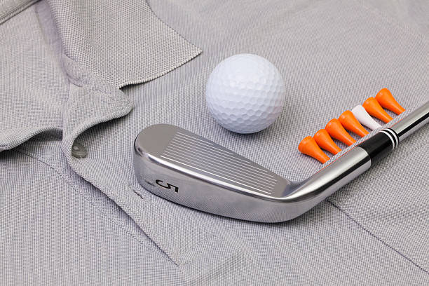 istock Grey polo shirt and golf equipments 526291274