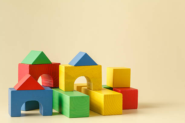 istock The toy castle from color blocks isolated on beige background 526292210