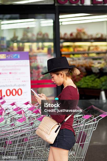 Thai Girl With Black Hat And Mobile Stock Photo - Download Image Now - Adult, Arts Culture and Entertainment, Bag