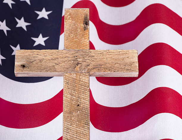 istock Memorial Day Cross and Flag 526300980
