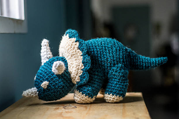 Knitted dinosaur #3 stock photo