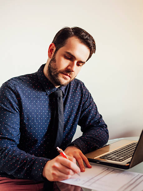 istock Business man filling out paper 526306461