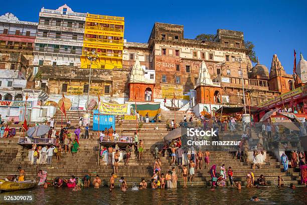 Hindu Pilgrims Take Holy Bath In The Ganges River Stock Photo - Download Image Now - Varanasi, Ghat, Ganges River