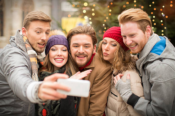 istock Friends having fun outdoors in winter city. 526309519