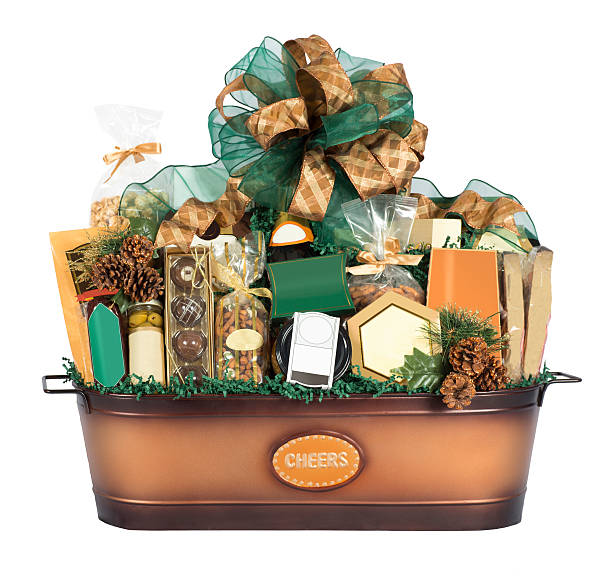 Huge festive gift basket filled with a variety of goodies including chocolates, pretzels, olives, and more.  \