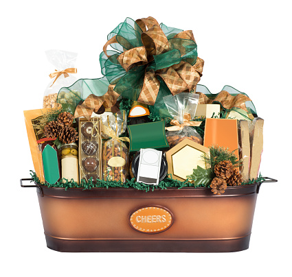 Huge festive gift basket filled with a variety of goodies including chocolates, pretzels, olives, and more.  