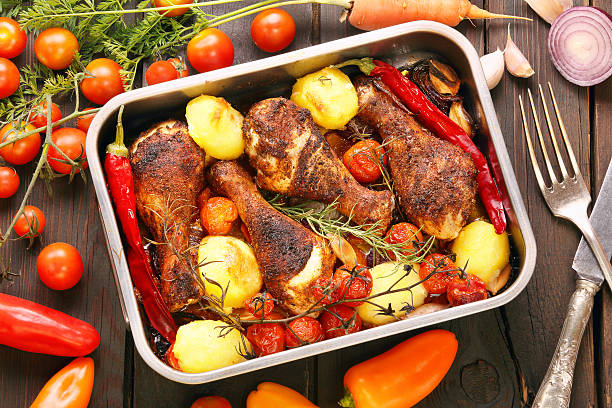 Chicken thighs roasted in the oven with beer, potatoes, onion and spices