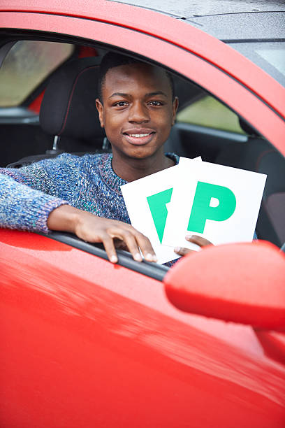 istock Teenage Boy Recently Passed Driving Test Holding P Plates 526313527
