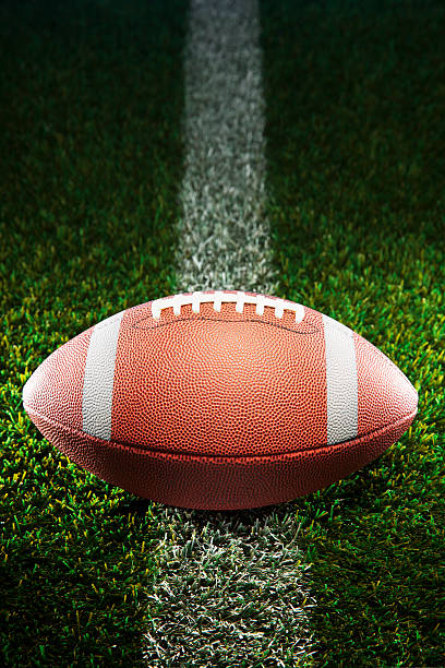 istock American College Football on Grass 526320479