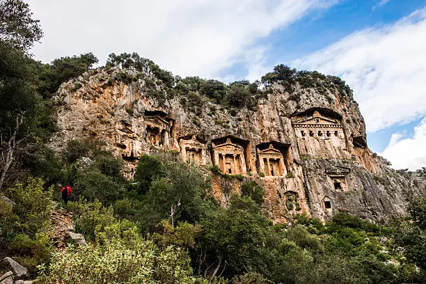 Lykian temple tombs cut out of the rock face above the Dalyan river at the ancient city of Kaunos in southern Turkey.