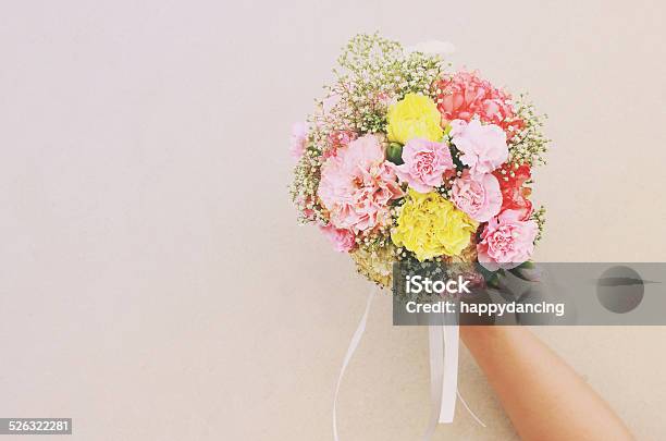 Bouquet Of Flower In Hand And White Wall Stock Photo - Download Image Now - Adult, Beautiful People, Beauty