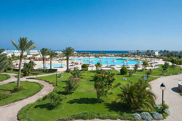 istock View over tropical resort swimming pool 526323953