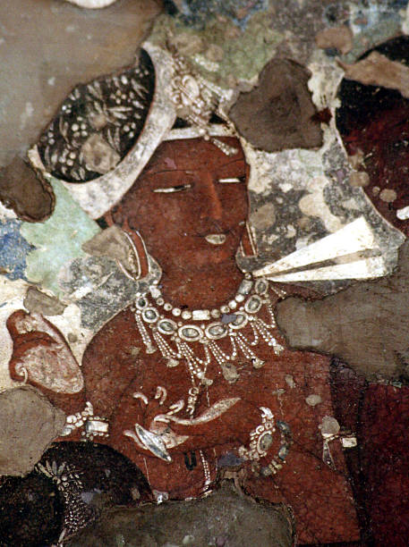 Mural Painting in Ajanta Cave - Jataka Tales Aurangabad, MH, India - June 22, 2008: Taken this picture while on a trip to world famous Ajanta Caves near Aurangabad, India. This 13th century mural painting is present in the main cave there. It is from the Jataka tales in buddhism which depicts different stages of life of Gautam Buddha. Caves are dark and with whatever natural light available took this picture without flash. ajanta caves photos stock pictures, royalty-free photos & images
