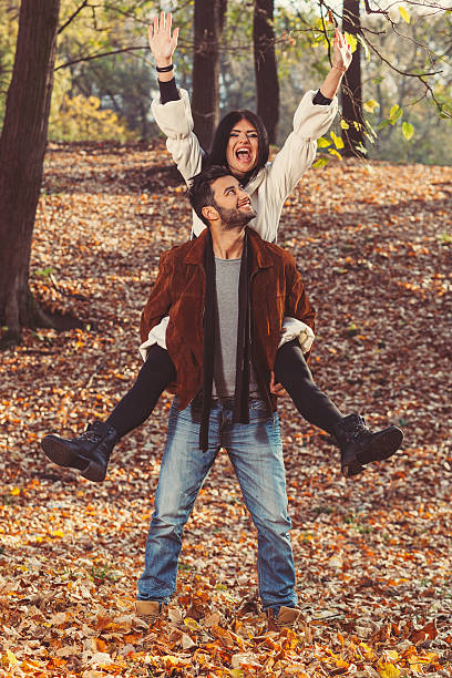 istock Man giving piggyback ride to girlfriend 526326801