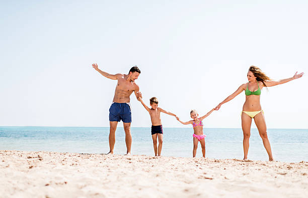 istock Playful family on the beach. 526326953