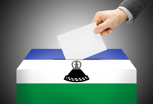 Voting concept - Ballot box painted into national flag colors - Lesotho