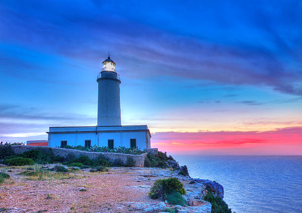 istock La Mola Cape Lighthouse Formentera at sunrise 526327897
