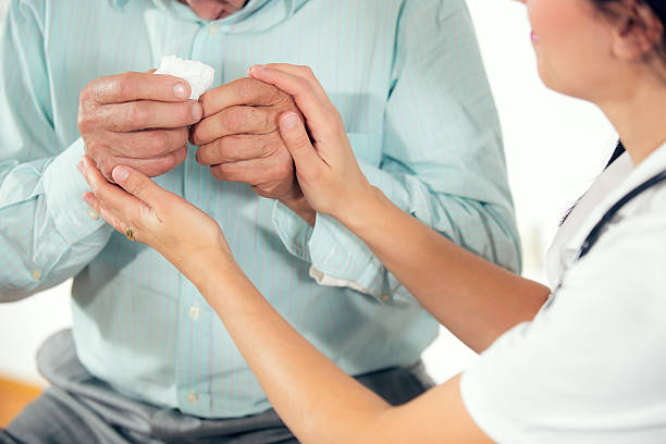 istock Doctor consoling senior man 526328087