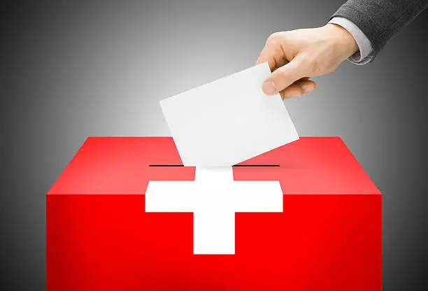 Voting concept - Ballot box painted into national flag colors - Switzerland