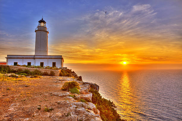 istock La Mola Cape Lighthouse Formentera at sunrise 526350333