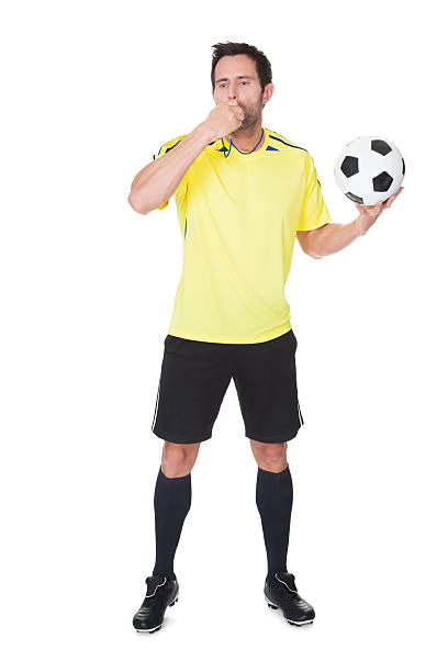 istock Soccer judge standing with ball 526350401