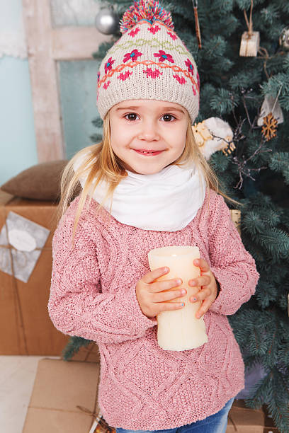 istock Little girl with candles 526352633