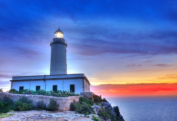 istock La Mola Cape Lighthouse Formentera at sunrise 526353223